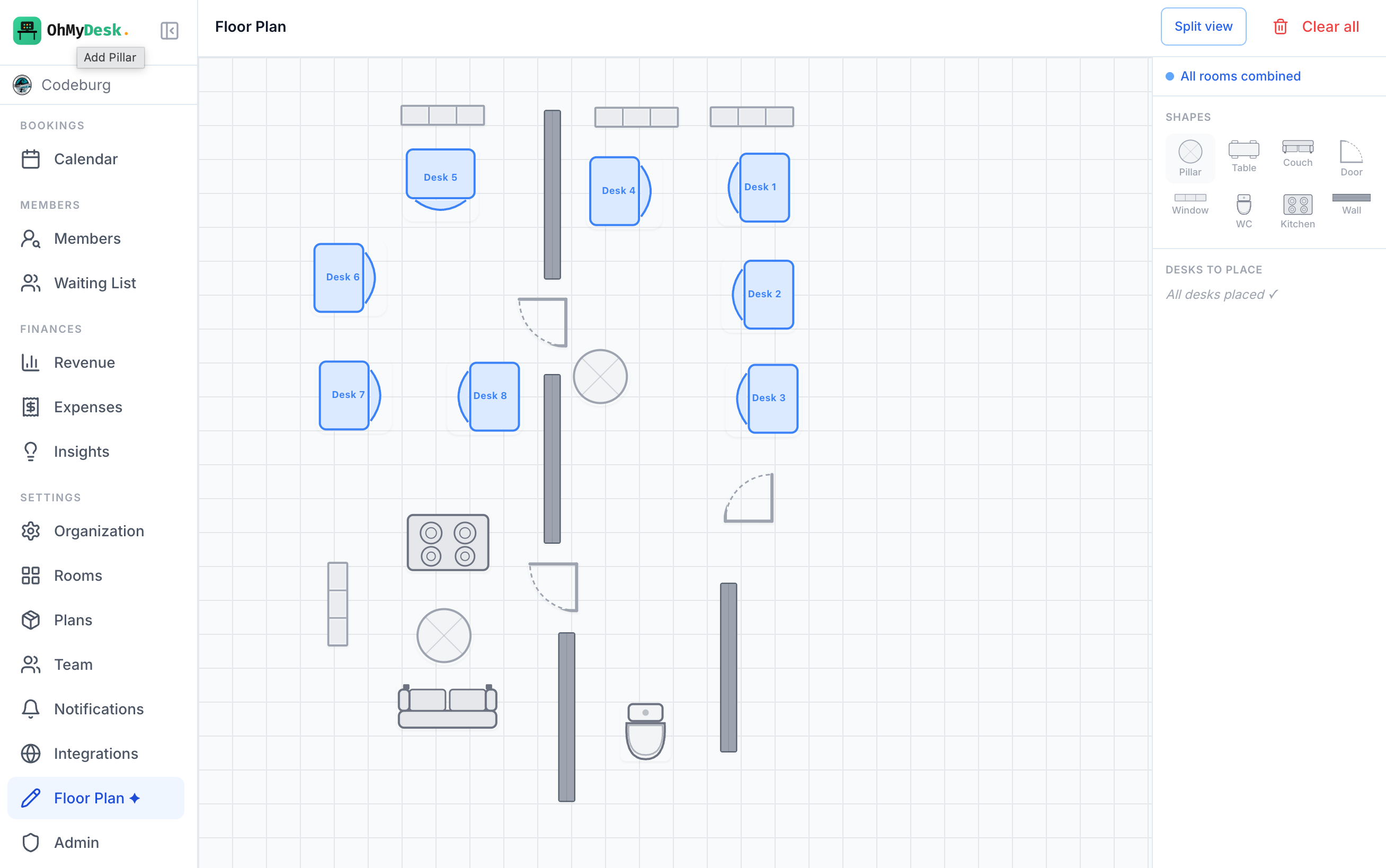 Floor plan editor canvas with desks and furniture placed on an interactive grid
